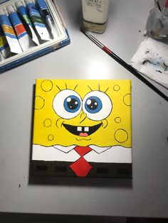 the spongebob is wearing a red tie and yellow shirt with big blue eyes