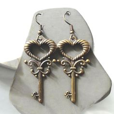 Brass colored earrings with small medieval keys They are lightweight with stainless steel hooks. Delivery is free. You can order multiple items at once without any additional costs. If you have any questions or comments, please write to me privately. I will be happy to answer you and satisfy your expectations. Looking forward to it! Colored Earrings, Brass Color, Wedding Shop, Jewelry Earrings Dangle, Beauty Book, Dangle Drop Earrings, Dangle Earrings, Accessory Gift, Jewelry Earrings