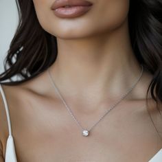 Get ready to fall in love with this gorgeous solitaire crystal necklace. Whether you're dressing up for a night out or just adding a little sparkle to your everyday look, this necklace has got you covered.  - 18" length (free custom sizing) with 2" extender - Crystal stone measures 6mm round - Prong setting - Silver, gold, or rose gold - Easy returns SHOP THE COLLECTION: https://www.etsy.com/shop/TigerlillyCouture PACKAGING: Arrives in a custom Tigerlilly box with a Tigerlilly microfiber storage Delicate Cubic Zirconia Necklace With Prong Setting, Diamond White Bridal Pendant Necklace, Dazzling Crystal Solitaire Necklace With Diamond Cut, Dazzling Solitaire Pendant Jewelry, Elegant Crystal Solitaire Necklace With Round Pendant, Elegant Solitaire Crystal Necklace With Round Pendant, Dazzling Solitaire Sterling Silver Necklace, Anniversary Crystal Pendant Necklace, Dazzling Solitaire Necklace In Diamond White