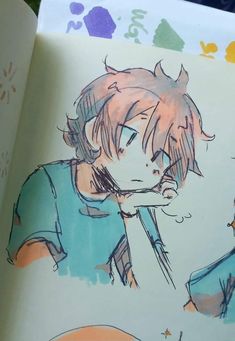 an open book with a drawing of a boy in blue shirt and cat ears on it