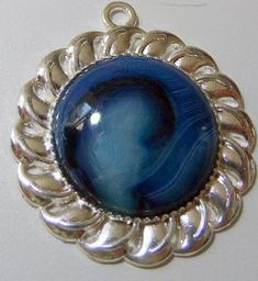 "Cloudy Blue onyx agate pendant bead in silver tone finding, natural stones,1 1/2\" diameter,This pendant could be wire wrapped or add charms Free shipping US A note about vintage, most items are used, and are 20, 30 or more years old. Occasionally, they can be found after being stored for many years, and are in pristine condition. Most have been gently used, and will show normal signs of use. All items are described as I accurately as can assess them. Pictures are the best description, and plea Blue Stone Pendant, Turquoise Charm, Blue Onyx, Aquamarine Stone, Healing Jewelry, Kansas City Mo, Agate Pendant, Moon Pendant, Silver Turquoise