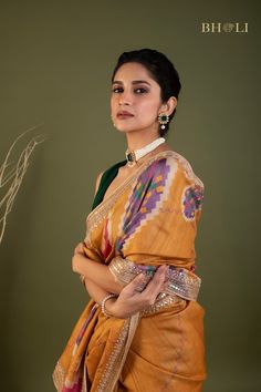 This exquisite handloom tussar silk saree features intricate gota and pearl work, handcrafted with precision and care. The digitally printed design adds a modern touch to this traditional piece, while the soft and flowy fabric ensures comfort and elegance. The perfect choice for those seeking a smart and contemporary saree. Bollywood Style Tussar Silk Pre-draped Saree With Motifs, Multicolor Dola Silk Pre-draped Saree With Motifs, Navratri Silk Saree With Gota Work, Designer Multicolor Tussar Silk Pre-draped Saree, Festive Silk Saree With Gota Work, Semi-stitched Tussar Silk Saree With Gota Work, Traditional Silk Saree With Gota Work, Traditional Tussar Silk Wear With Gota Work, Katan Silk Pre-draped Saree With Motifs For Designer Wear