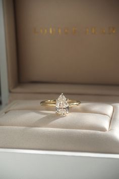 a close up of a ring in a box