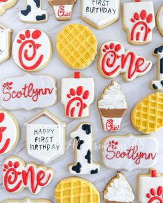 decorated cookies are displayed on a white surface