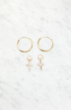 Elevate your everyday style with LA Hearts' Mini Cross Rhinestone Hoops – versatile earrings that effortlessly blend sophistication with a hint of edge. Adorned with delicate rhinestones, these hoops come with a removable cross charm, allowing you to switch up your look and wear them with or without the distinctive cross for a touch of personalized flair.


	Includes 1 pair of earrings
	Gold hoops
	Rhinestone-studded cross charms
	Clasp closure Little Hoop Earrings, Slim Fit Cargo Pants, Earrings Gold Hoops, Cute Homecoming Dresses, Mini Cross, Matching Jewelry, Christian Jewelry, Cross Earrings, Rhinestone Studs