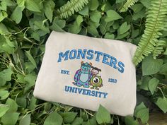 Introducing our Monster’s University Crewneck Embroidered Sweatshirts, the ultimate trending crewneck for Disney enthusiasts! Made with high-quality fabric, this shirt Trending Crewneck, Monster S, University Crewneck, Hawaiian Shirt Women, Monsters University, University Logo, Cartoon Sweatshirts, Monster University, Embroidered Crewneck