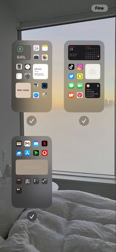 an image of a bed with different app icons on the screen and in front of a window