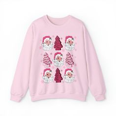 Christmas Tree Cake Sweatshirt, Pink Santa Sweatshirt, Funny Holiday Pullover, Retro Hippy Santa Shirt, Preppy Christmas Sweatshirt 💫Ideal for any situation, a unisex heavy blend crewneck sweatshirt is pure comfort. 💫 Made with a medium-heavy fabric blend of 50% cotton and 50% polyester, this sweatshirt feels cozy and is the perfect choice for those colder months. 💫 Made using 100% ethically grown US cotton. Gildan is also a proud member of the US Cotton Trust Protocol ensuring ethical and su Winter Crew Neck Sweatshirt With Cartoon Print, Winter Cartoon Print Crew Neck Sweatshirt, Casual Christmas Sweatshirt With Cartoon Print, Christmas Long Sleeve Tops With Cartoon Print, Holiday Crew Neck Top With Cartoon Print, Pink Long Sleeve Christmas Sweater, Casual Pink Christmas Sweater, Pink Tops As Winter Gifts, Pink Crew Neck Top For Christmas