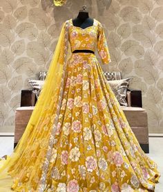 Made to Order/Measurement/Custom Order Lehenga - Color : Yellow - Fabric : Embroidered Georgette  - Fully flared paneled lehenga -   Attached  Dupatta with Blouse - Drawstring closure with Tassels - - It can be customize in any design or size  PLEASE NOTE: BUYERS ARE RESPONSIBLE FOR ANY CUSTOMS AND IMPORT TAXES THAT MAY APPLY. This is a made to order product. If you opt for 'Made To Measurement Option', we will provide a measurement template and you can share the measurements likewise. If you want to opt for 'Standard Size', Please refer to the size chart provided in the listing. Shipping: Standard Shipping is done by DHL ecommerce and it mostly takes 2 to 3 weeks to deliver after dispatch. Express Shipping is done by DHL express and it mostly delivers within a week after dispatch. Fabric Designer Yellow Anarkali Set With Intricate Embroidery, Festive Yellow Anarkali Set With Intricate Embroidery, Yellow Anarkali Set With Intricate Embroidery In Dola Silk, Yellow Dola Silk Anarkali Set With Intricate Embroidery, Yellow Saree Set With Zari Work, Fitted Yellow Traditional Wear With Traditional Drape, Yellow Fitted Traditional Wear With Traditional Drape, Yellow Fitted Traditional Wear With Drape, Festive Yellow Sets With Intricate Embroidery