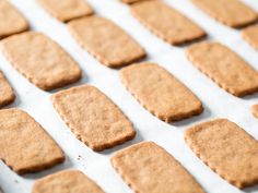 cookies are lined up on a baking sheet