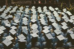 rows of chairs covered in white paper with writing on them