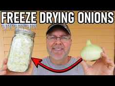 a man holding up a jar filled with onions next to a garlic clover