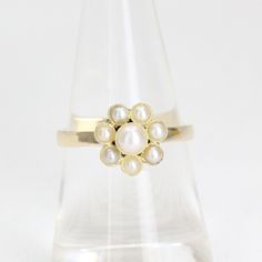 An antique 9 carat yellow gold seed pearl set daisy dress ring. Featuring a central seed pearl, surrounded by seven seed pearls forming a flower in the form of a daisy.  This ring was once a stickpin. I have had my jeweller convert into a lovely handmade dress ring. Circa: 1890's Weight: 2.7 grams Ring Size: M  -  6  Condition: Please refer to all images for overall condition. Should you have any questions, please don't hesitate to contact me.... SHIPPING IN AUSTRALIA If you would like to reduce Daisy Design, Daisy Ring, Ring Flower, Daisy Dress, Dress Ring, Handmade Dress, Pearl Set, Dress Rings, Seed Pearl