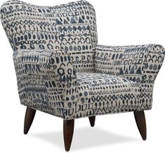 a blue and white patterned chair with wooden legs