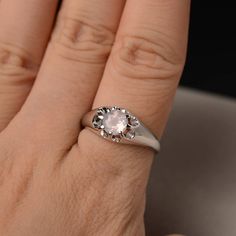 This is a gorgeous handmade creation. Its beauty is its simplicity & Elegance. The 6*6mm round shape faceted natural pink quartz is crafted in solid sterling silver and with rhodium plated. All item is sent in a beautiful gift box If you have any idea of design your ring,pls contact me directly. You can realize more lovely stuff clicking the link https://www.etsy.com/shop/knightjewelry?refshopsection_shophome_leftnav Please leave the correct address and you phone number for delivering succes Elegant Pink Moonstone Sterling Silver Ring, Delicate Silver Crystal Ring, Silver Solitaire Moonstone Ring Round Cut, Morganite Crystal Promise Ring, Round Rose Quartz Promise Ring, Rose Quartz Crystal Promise Ring, Silver Morganite Round Rings, White Gold Birthstone Ring With Rose Cut Diamonds, Gift Morganite Crystal Ring, Round Shape