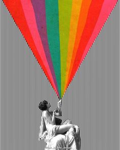 a woman sitting on top of a rainbow colored hot air balloon