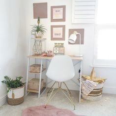 a white chair sitting in front of a desk with a pink rug on top of it