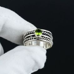 Green Peridot Spinner Rings, 925 Sterling Silver, Handmade Rings, August Birthstones, Peridot Silver Rings, Meditation Ring, Gift For Her Product Details: Gemstone : Peridot Metal : 925 Sterling Silver Item : Ring Approx Weight : 6 grams ABOUT PERIDOT ♥ Healing ♥ Renewal ♥ Purification ♥ Rebirth ♥ Growth ♥ Relaxation ♥ Comfort ♥ Intuition Peridot is a powerful cleanser. It releases and neutralises toxins on all levels. Alleviates jealousy, resentment, spite, bitterness, irritation, hatred and greed. Reduces stress, anger and guilt. Peridot opens our hearts to joy and new relationships. It enhances confidence and assertion, motivating growth and change. STYLE STATEMENT Looking for the perfect ring? Well, you've just found it. This dazzling ring from SD is perfectly crafted to suit you. OUR Silver Peridot Birthstone Ring, Silver Ring With Peridot Birthstone, Silver Peridot Ring With Birthstone, Silver Peridot Round Rings, Green Sterling Silver Stackable Crystal Ring, Green Stackable Sterling Silver Crystal Ring, Silver Peridot Rings Fine Jewelry, Silver Peridot Rings In Fine Jewelry Style, Peridot Rings Stamped 925 For Anniversary