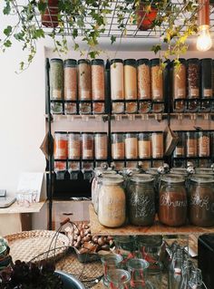 jars filled with different types of spices on top of a table