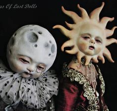 two dolls are dressed up as the sun and moon