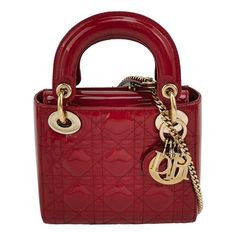 Lady Dior Mini Handbag Red Patent Leather Gold-tone Leather and Chain Strap These are professional photos of the actual bag. This Lady Dior Mini handbag features a stunning red color in patent leather decorated with gold hardware, gold embellished chain strap, making it an ideal accessory for any stylish woman who dares to make a bold statement with their accessory. The mini bag is a cute, yet luxurious addition to your wardrobe, boasting a crossbody strap. Crafted with durability in mind, this classic bag is sure to remain fashionable for years to come. CONDITION: EXCELLENT CONDITION This preloved authentic Dior bag is in excellent condition with minimal signs of wear. There may be light scratches to the hardware. DETAILS Brand: Christian Dior Model: Lady Dior Exterior Material : Patent L Lady Dior Mini, Mini Lady Dior, Pochette Louis Vuitton, Dior Monogram, Dior Top, Professional Photos, Leather Decor, Pink Handbags, Mini Handbag