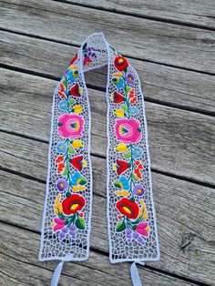 Dress up any outfit in your wardrobe with beautiful embroidered accessories! Add interest to a casual outfit with a beautiful belt. Embroidered by hand in Hungary, Kalocsa city.  This is an unique handmade work. This is a perfect gift for friends and for your family. Original Kalocsa work! lenght , 34" width , 2,5" If you are buying several pieces I can combine postage at the time of mailing. If you have any question please don't hesitate to contact me For vintage Hungarian emboridery please vis Bohemian Multicolor Embroidery Belts For Festival, White Fabric Belt For Summer, Handmade Bohemian Belt With Multicolor Embroidery, Bohemian Multicolor Belts For Spring, Festival Fabric Belt With Multicolor Embroidery, Festival Multicolor Embroidery Fabric Belt, Multicolor Embroidered Fabric Belt For Festival, Spring Festival Fabric Belt, Handmade Bohemian Belts As Gift