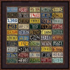 an old license plate frame with many different colors and numbers on the front, including one for