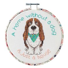 a dog with a green bandanna on it's collar is shown in the hoop