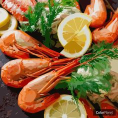 lobsters, lemons and parsley on a black surface with the words color planet above them