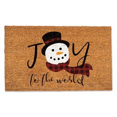 a door mat that says joy to the world with a snowman wearing a top hat and scarf