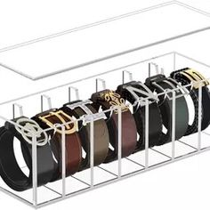 a rack with six belts in it