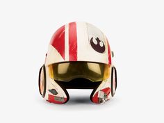 a star wars helmet is shown against a white background with red and white stripes on it