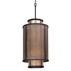 a light fixture with a brown shade on the bottom and black metal trim around it