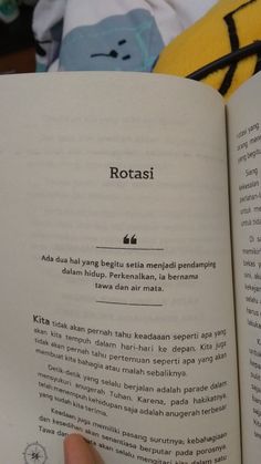 a person is holding an open book in front of their face and the text reads rottasi