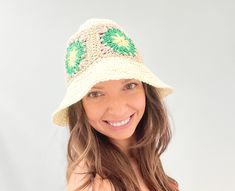 A straw bucket hat for women is a stylish and functional accessory that provides sun protection while adding a touch of fashion to any outfit. It is made from natural straw materials and features a wide brim to shield the face and neck from harmful UV rays. The hat's bucket shape provides excellent coverage and allows for easy wear, while the straw construction provides durability and breathability for maximum comfort. Perfect for summer outings, beach trips, and outdoor events, a straw bucket h Handmade Straw Bucket Hat For Spring, Cream Bucket Straw Hat, One Size, Cream Bucket Straw Hat, Cream Summer Bucket Straw Hat, Cream Summer Bucket Hat, Handmade Spring Sun Hat, Bohemian Mini Bucket Hat For Summer, Trendy Green Crochet Hat For Beach, Trendy Green Crochet Hat For The Beach