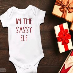 This Cute And Minimal Onesie Says I’m The Sassy Elf On It. White Onesie With Red Text. Nwot. No Stains Or Holes Excellent Condition. Christmas Onsies Baby, Christmas Onsies, White Onesie, Christmas Baby, Onesies, Elf, Red White, Baby Clothes, Red And White