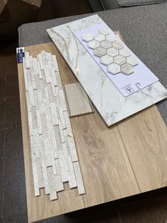 some tile laying on top of a wooden table