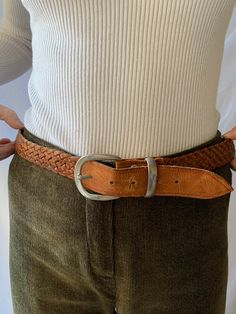 Introducing our exquisite braided brown leather belt, crafted for those who appreciate elegance and style. With a width of just 2.5 cm, this belt is perfect for complementing your ensemble, adding a refined and sophisticated touch. Not only is this belt functional, but it is also a true work of art, proudly made in Spain - a country renowned for its craftsmanship in leatherwork. Attention to detail and high-quality materials make it a reliable accessory that will maintain its allure for many years to come. A special highlight is its vintage design inspired by the style of the 70s. This belt seamlessly blends classic elegance with the nostalgic charm of past decades, making it a unique addition to your wardrobe. Take a step towards style and quality with this braided brown leather belt, acc Classic Braided Leather Belt, Formal Leather Rope Belt, Classic Leather Rope Belt, Vintage Brown Belt With Antique Buckle, Vintage Brown Belts And Suspenders With Antique Buckle, Brown Formal Belt With Antique Buckle, Brown Leather Rope Belt, Vintage Leather Belt And Suspenders In Vintage Brown, Vintage Leather Belts And Suspenders In Brown