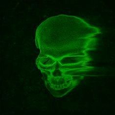 a glowing green skull in the dark