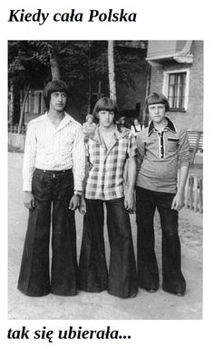 three young men standing next to each other in front of a house with trees on the sidewalk