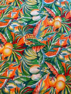 an orange and green tropical print fabric with leaves, flowers, and fruit on it