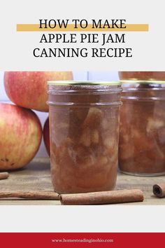 two jars filled with apple pie jam sitting on top of a table next to cinnamon sticks