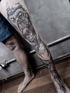 a man with a tattoo on his leg