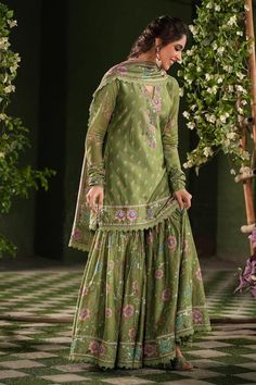 Dark green floral printed kurta with embroidered neckline, hem-line and sleeves. Comes with matching sharara sprinkled with sequin cheentas and contrasting dupatta with embroidery and lace details. - Aza Fashions Semi-stitched Green Sharara With Chikankari Embroidery, Pista Green Meenakari Sets For Eid, Unstitched Pista Green Sharara In Chinon, Eid Green Sharara With Meenakari Details, Festive Green Meenakari Sharara, Green Semi-stitched Sharara With Traditional Drape, Unstitched Pista Green Sharara With Dabka Work, Unstitched Pista Green Designer Sharara, Semi-stitched Pista Green Sharara With Dupatta