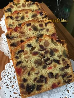 three slices of fruit cake sitting on top of a doily