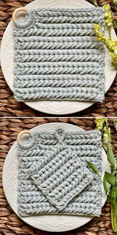 two plates with knitted napkins on them and flowers in the middle one is white