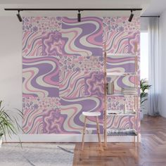 a pink and purple wall mural in a living room