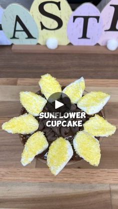 the sunflower cupcake has been decorated with chocolate and yellow icing