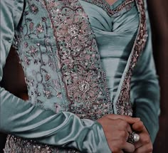 a close up of a person wearing a dress