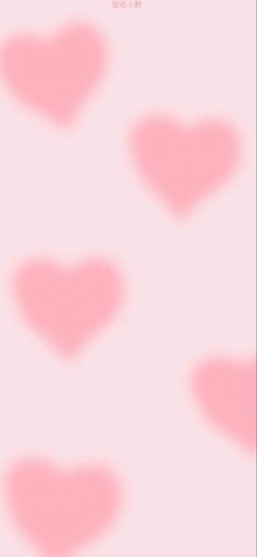 pink hearts are arranged in the shape of small heart shapes on a light pink background